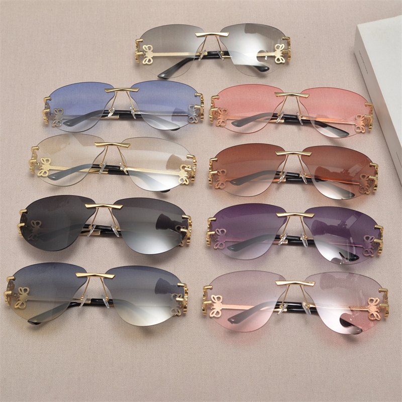 European and American retro large-frame cut-edge sunglasses for women, trendy and sophisticated, with floral decorations, rimless, round face slimming, sun glasses.