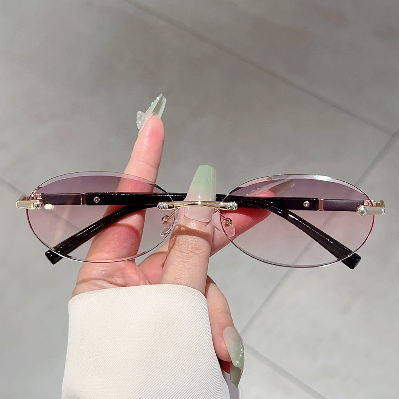 Foreign Trade New Style Frameless Cut Edge Oval Small Frame Fashionable Sunglasses European and American Trendyy Popular Same Style High-End Sunglasses